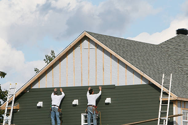 Professional Storm Damage Siding Repair technician working in Morrisville, PA